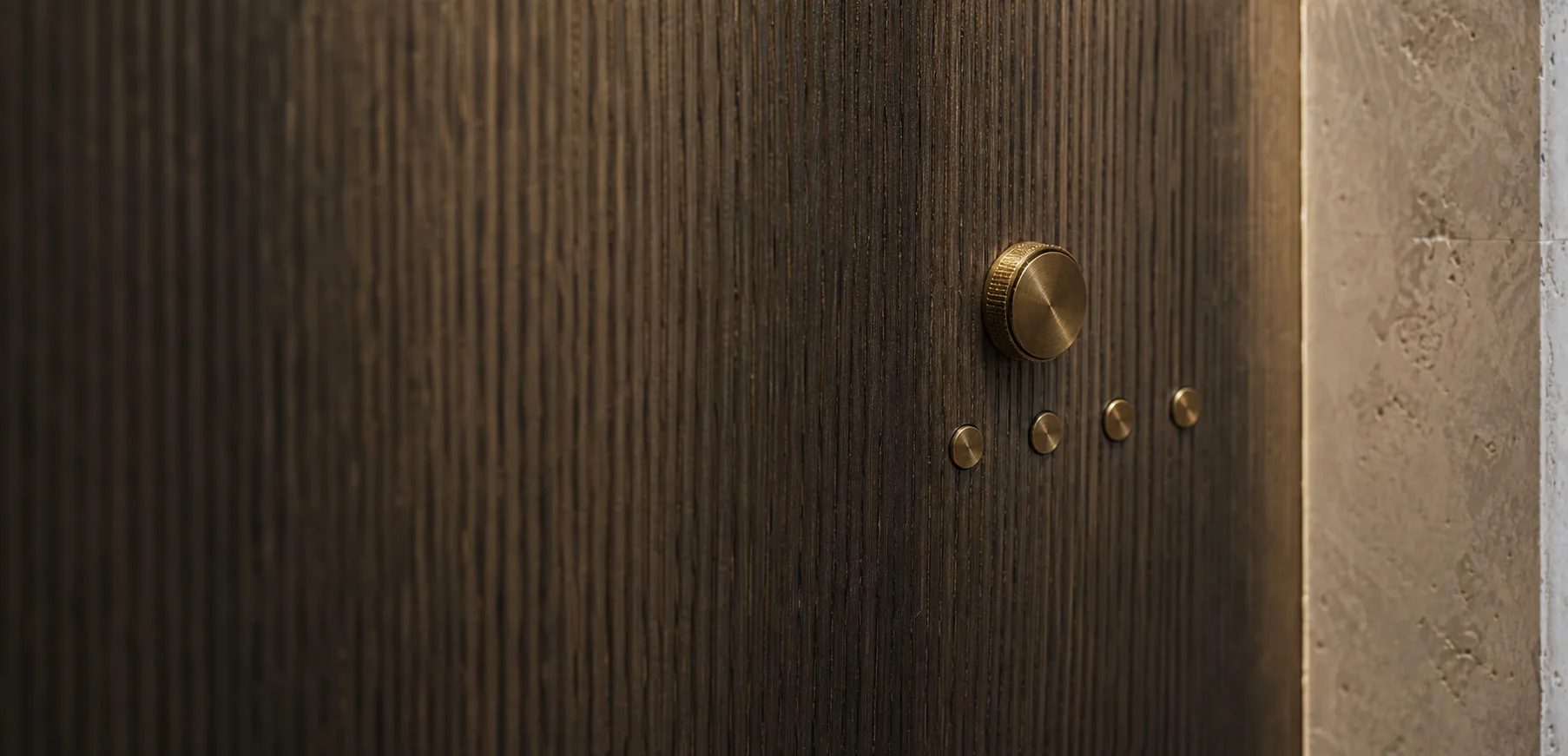 Concept image of bespoke circular smart home controls integrated into smoked oak
